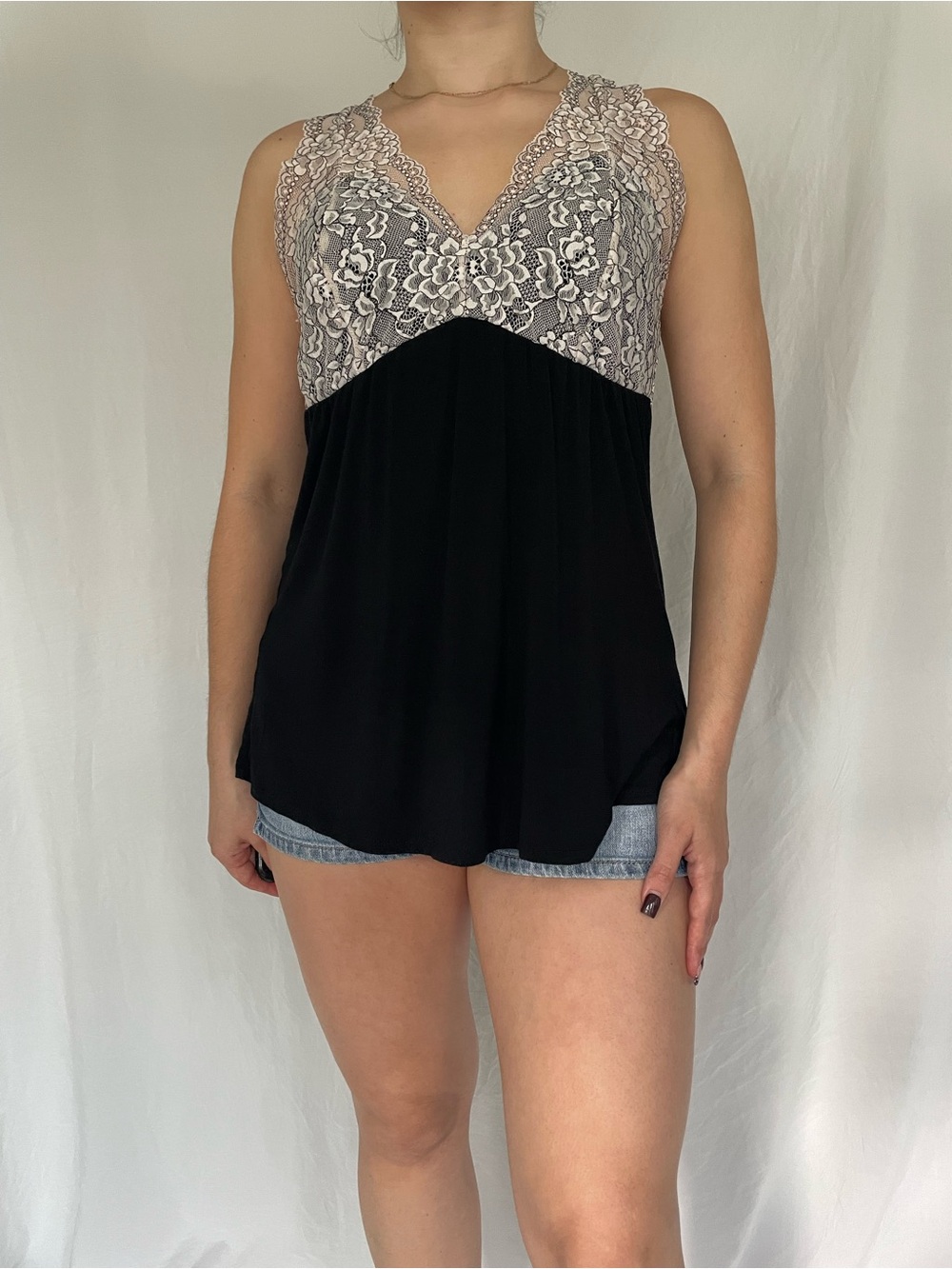 Black lingerie camisole with white floral lace